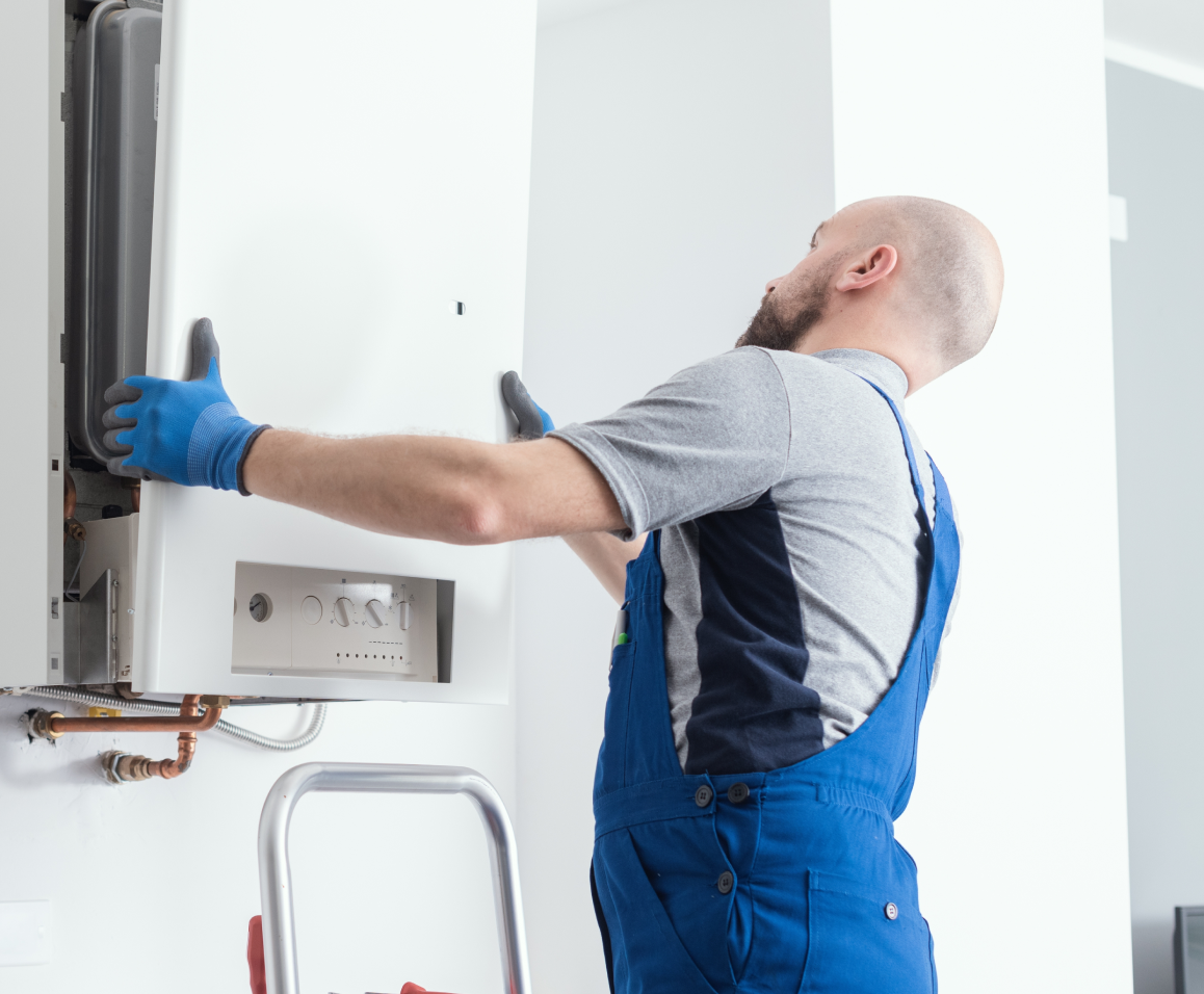 Person Replaces Boiler